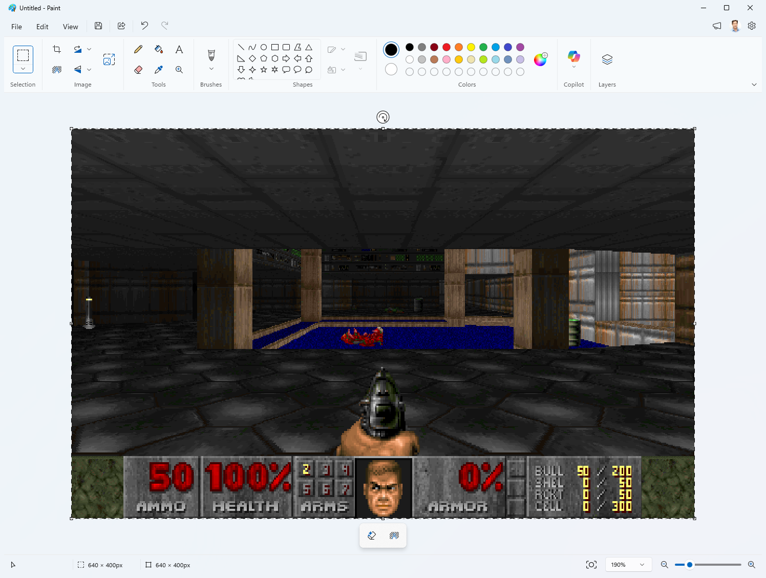 Doom berjalan di dalam kanvas Microsoft Paint